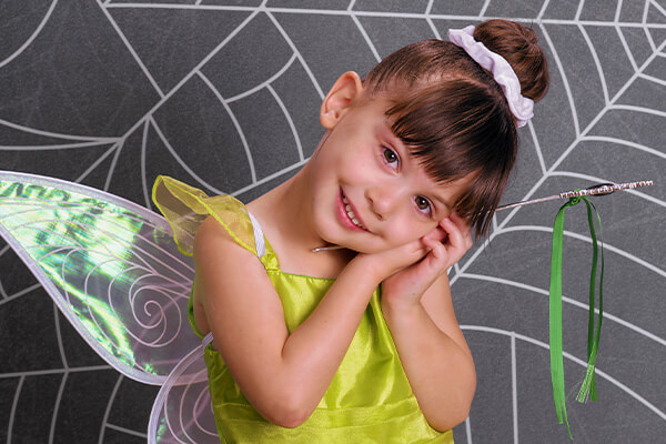 Girl in a fairy dress for professional kids Halloween photos at JCPenney Portraits.