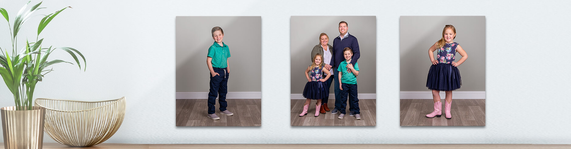 Wall featuring three canvases with family photography from your JCPenney Portrait session.