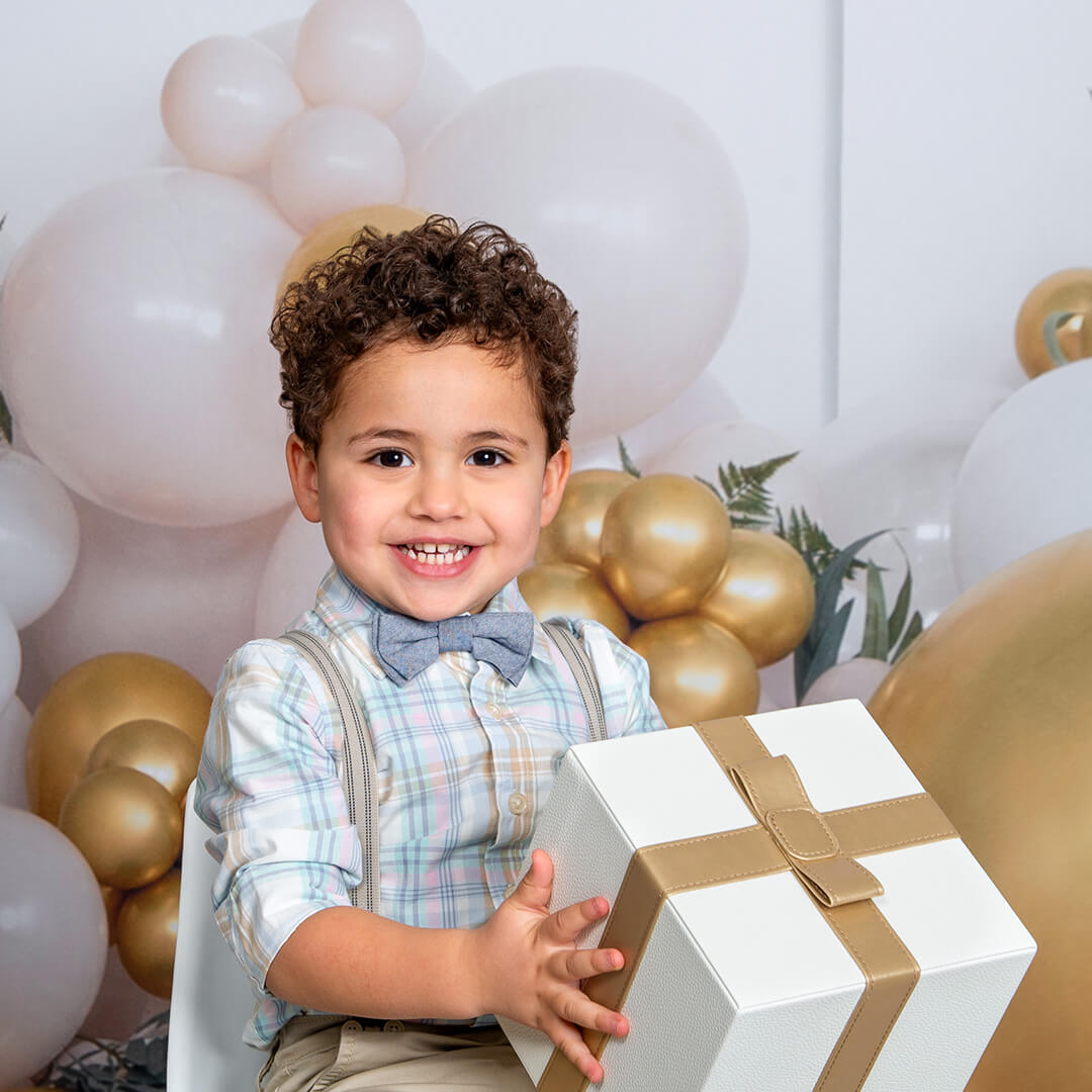 Birthday Photoshoot for a boy on the celebration background at JCPenney Portraits.